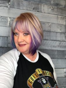 Cheryl shares her rockin' personal style in a Guns N Roses shirt and purple and blonde hair.