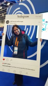 Elaine stands inside an Instagram photo prop from Cisco Live.
