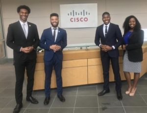 Charlie standing with peers in business clothes for Connected Black Professionals.