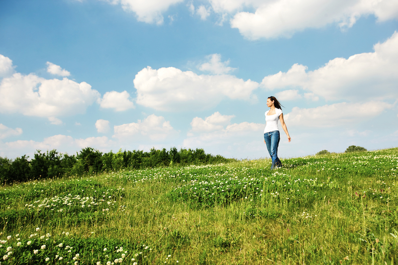 girl standing in meadow