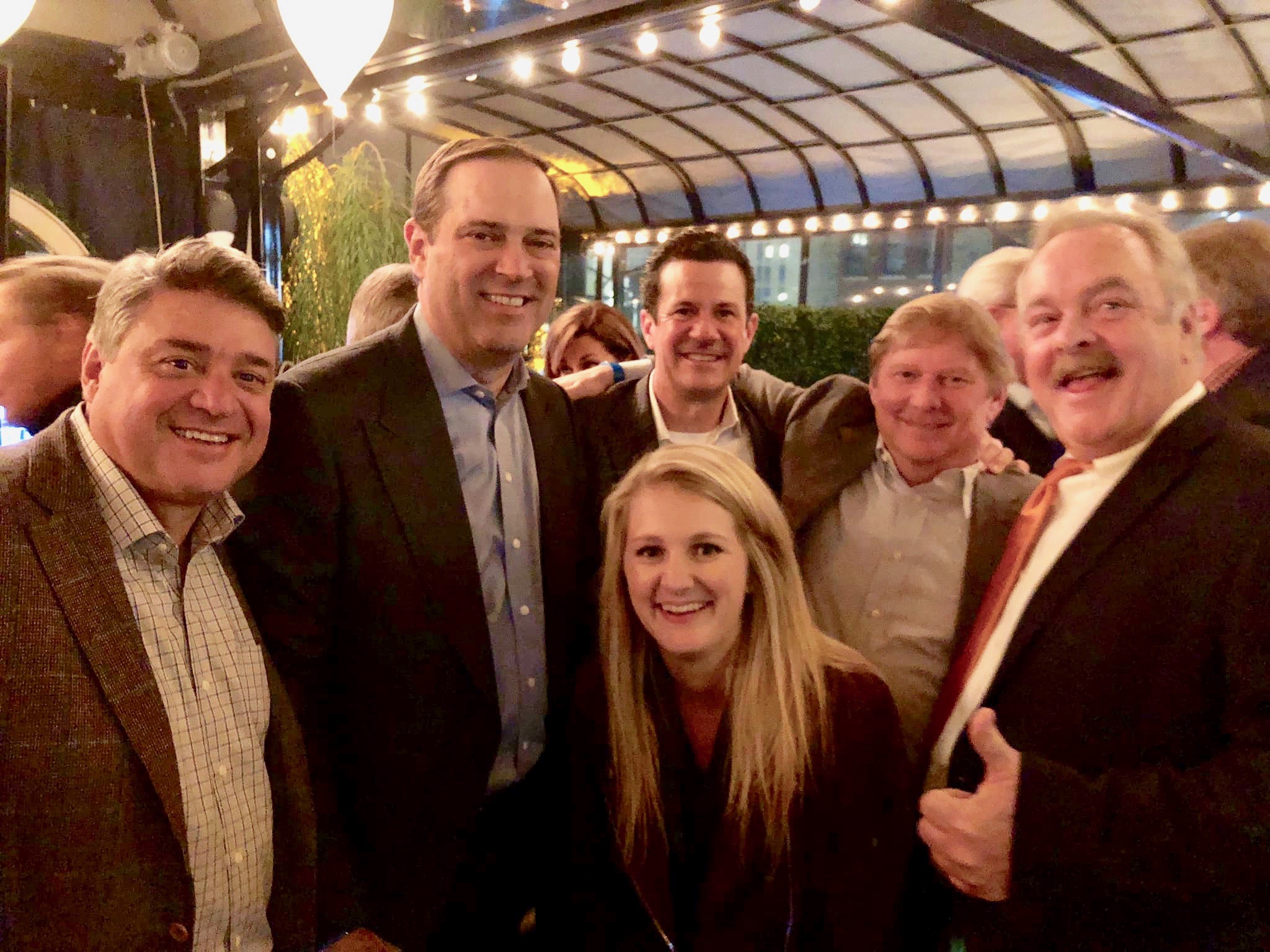 Blakely with her Dad, co-workers, and our CEO Chuck Robbins at a retirement party.