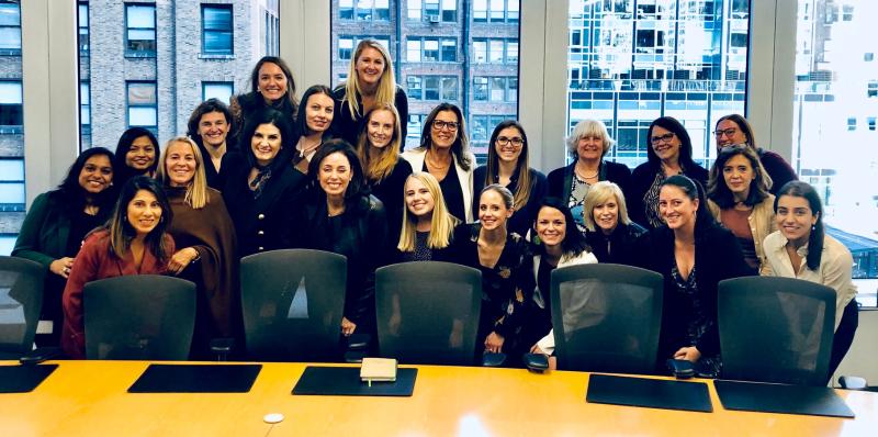 Blakely and her peers smiling with Gerri Elliott, our Chief Sales and Marketing Officer, and Fran Katsoudas, our Chief People Officer, in the New York City office.