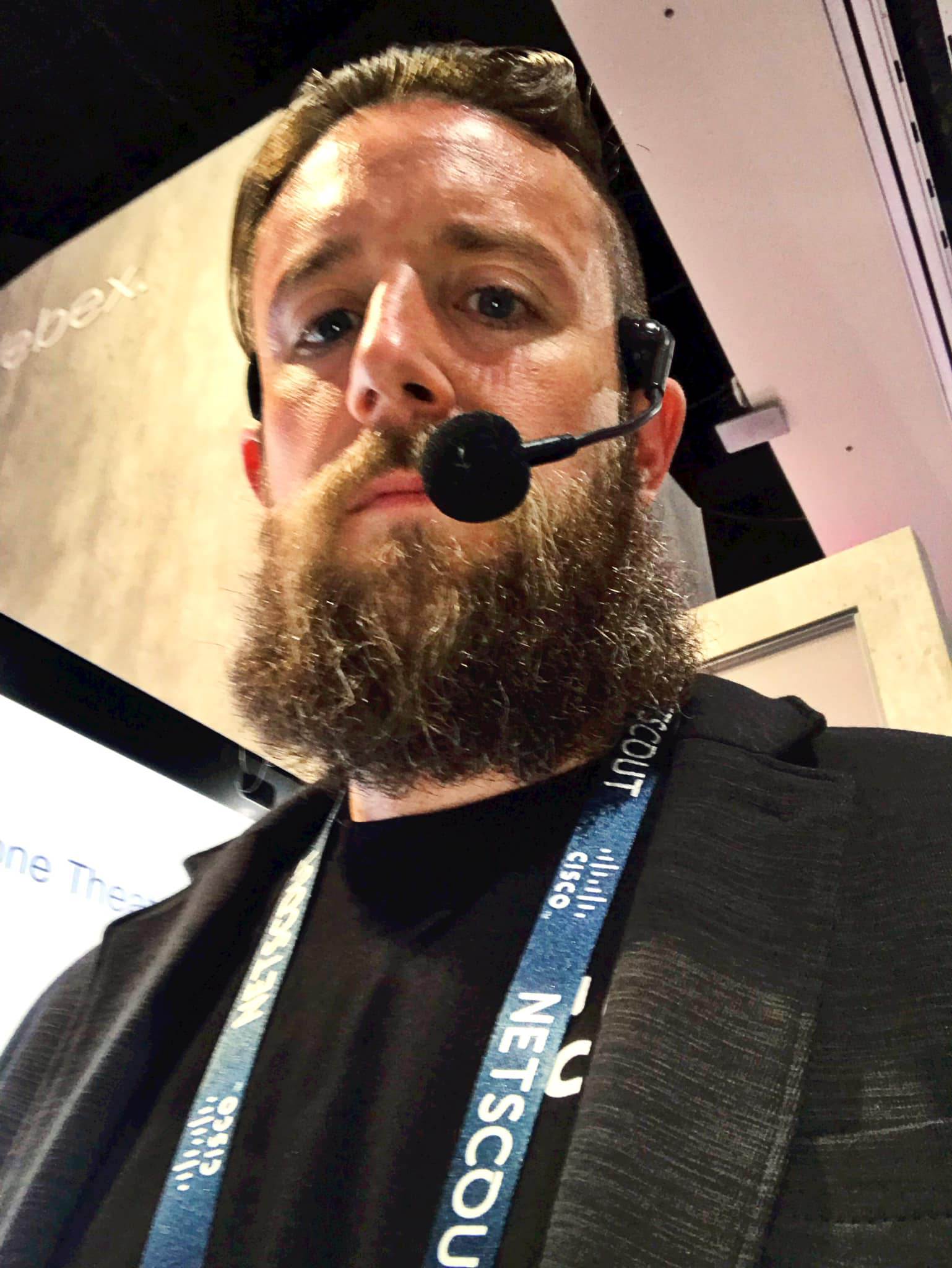 Chris presents again at Cisco Live US but this time more himself with a full beard, t-shirt, and jacket.