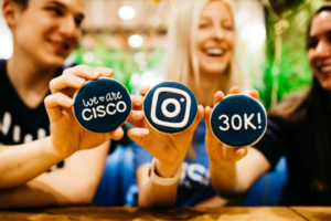 3 Cisco Employees show WeAreCisco Instagram cookies made by Ileana.
