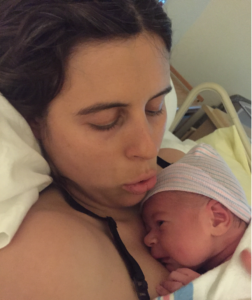 Joana with her first child after giving birth. 