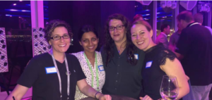 Nish and 3 of her peers and fellow #WomenInTech smiling at Cisco Impact.