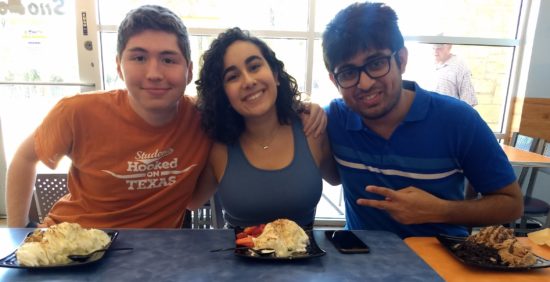 Andrea and two other Cisco interns enjoy treats at an event on campus.