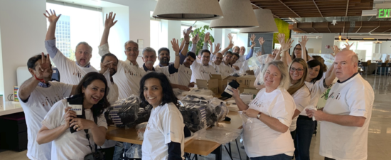 Pat and her team assembling hygiene kits for the homeless.