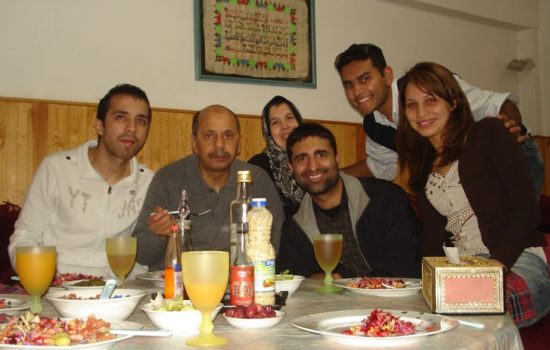 Shalveen sitting with yet another Cisco family enjoying a meal in Morocco.
