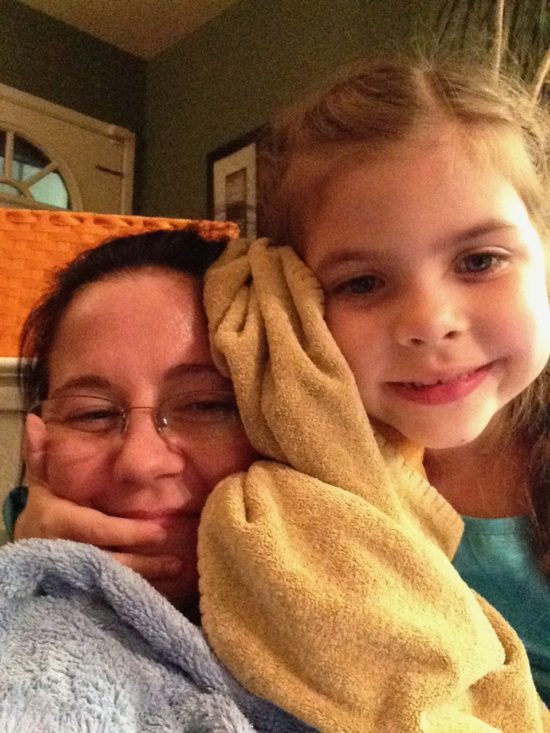 Danielle and her daughter Helene cozy up in blankets.