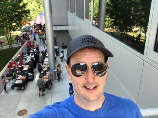 A selfie of Jeff with the annual RTP Family Day frestivities behind him.