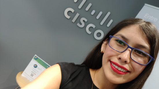 Yartiza poses in front of a Cisco sign.