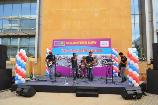 Employee rock band the Lone Rangers perform at a volunteer event for the Akshaya Patra Foundation