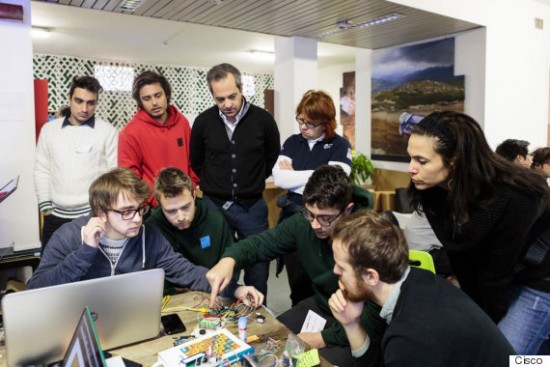 Students in Milan learning the importance of the Internet of Everything during their hands-on lessons in IT.