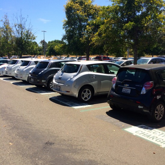 A row of electric cars charges at Chargepoint stations on Cisco's San Jose campus