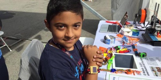 Omkar Govil-Nair, son of Cisco employee Shubha Govil, shows off his OWatch at Maker Fair.