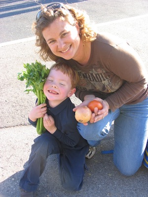 A mother and son pick up food from the Second Harvest Food Bank