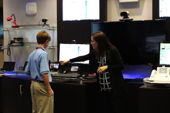 A Cisco employee mentor shares a demo with a student at a STEM mentoring event October 7 in Richardson, Texas. 