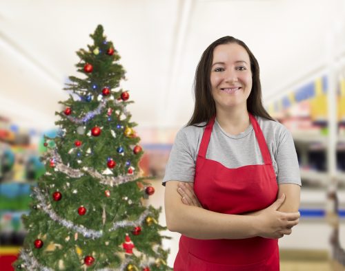 portrait of a saleswoman with crossed arms on Christmas