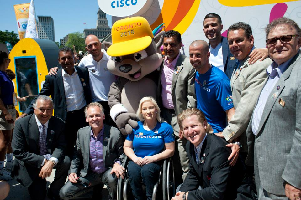 Cisco Canada executives and Canadian athletes Ryan Homsy and Melanie Hawtin with the Cisco TORONTO 2015 Countdown Clock.